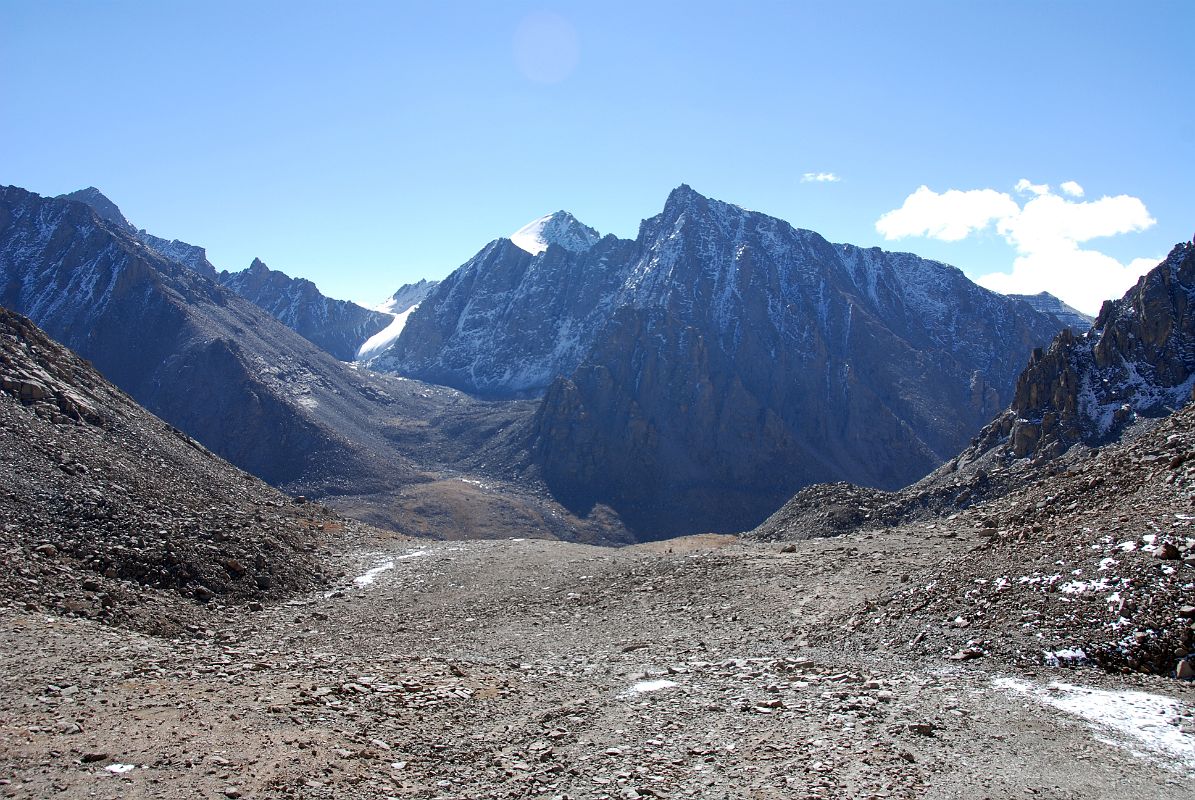 56 Peaks Above Lham Chu Eastern Valley On Descent From Dolma La On Mount Kailash Outer Kora On the descent from the Dolma La, the view ahead is to the peaks on the far side of the Lham Chu Eastern Valley. The peaks to the right of centre are called Tsering Chenga, the abode of five sister protectoresses, who were entrusted by Milarepa to guard Kailash.